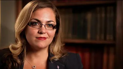 Best Buy Insurance A young woman with glasses looking into the camera