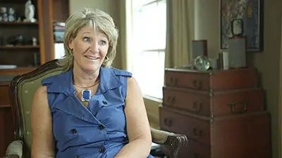 National Truck League A woman sitting in an armchair