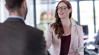 How Digital Agencies Provide Better Advice A man and a woman standing in an office while shaking hands