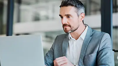 Brokerage Roundtable: Our Digital Path Forward a businessman using a laptop